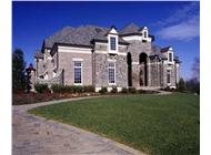 This image shows the front elevation for these European House Plans.