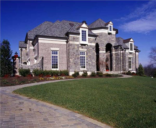 This image shows the front elevation for these European House Plans.