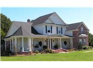 This is a color photo of these Country Homeplans.