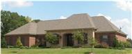 This is a color photo of these French Country House Plans.