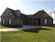 This image is an angled front elevation of these European Home Plans.