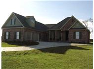 This image is an angled front elevation of these European Home Plans.