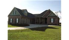 This image is an angled front elevation of these European Home Plans.