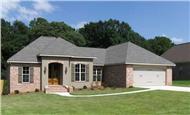 This is a color photo of the front of these Acadian House Plans.