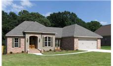 This is a color photo of the front of these Acadian House Plans.