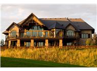 This is a color photograph showing this set of house plans from the rear.