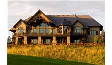 This is a color photograph showing this set of house plans from the rear.