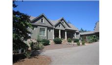 This is a color photo of these Craftsman Home Plans.