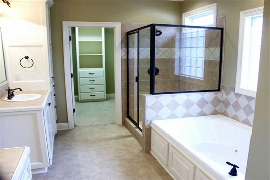 Master Bathroom: Tub of this 4-Bedroom,3000 Sq Ft Plan -141-1005