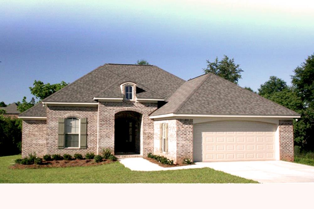 Color photo of Acadian home plan (House Plan #142-1062) at The Plan Collection.