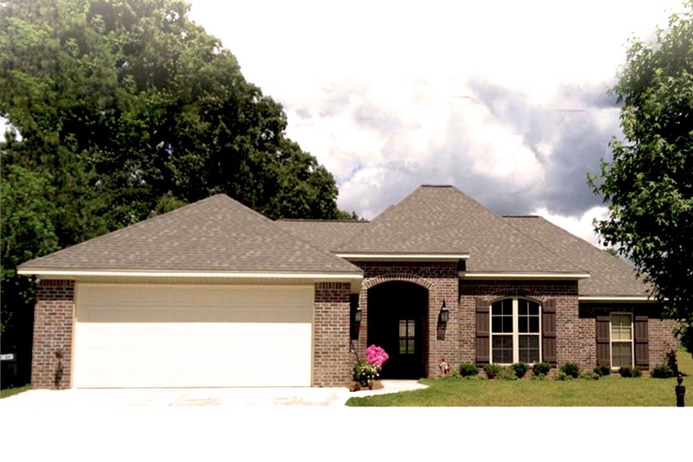 Color photo of Acadian home plan (House Plan #142-1070) at The Plan Collection.