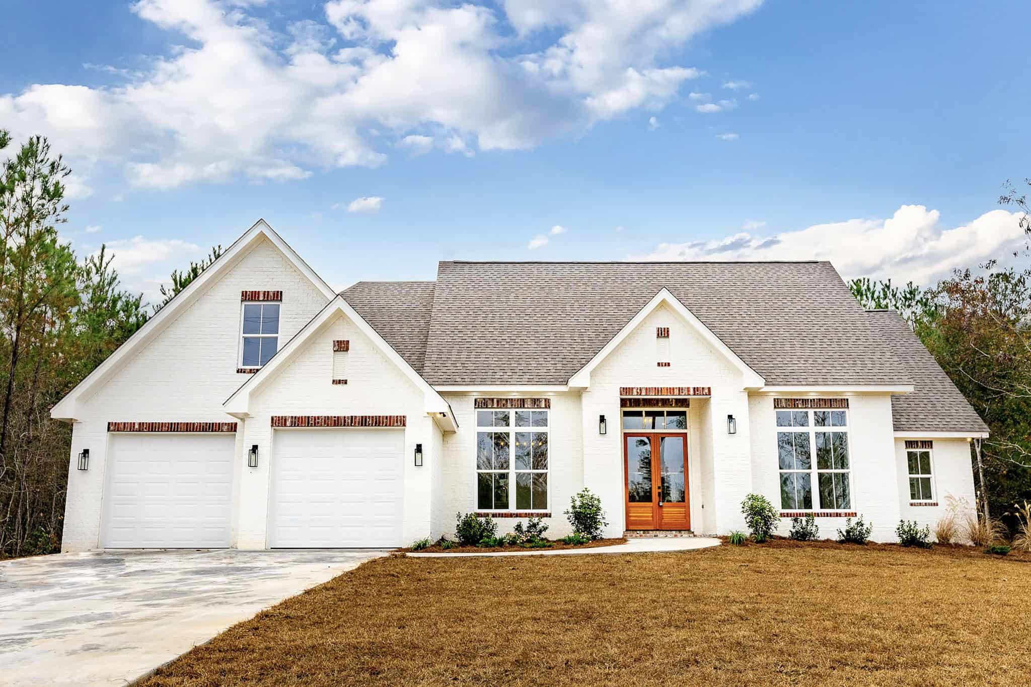 Front elevation of Modern Farmhouse home (ThePlanCollection: House Plan #142-1568)