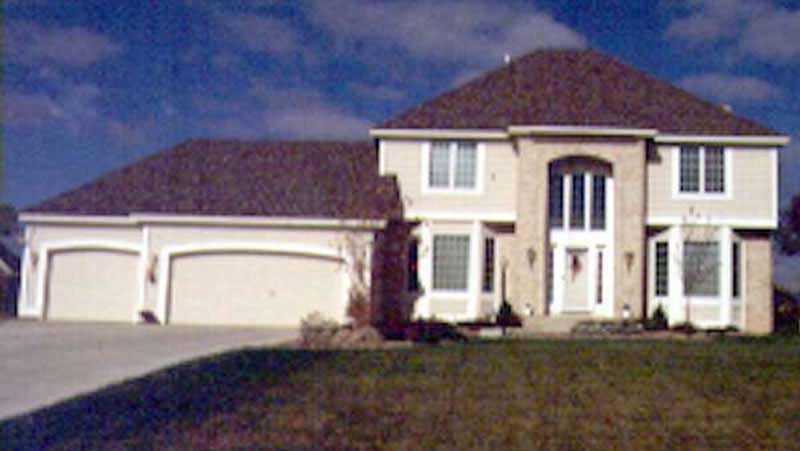 Front view of European home (ThePlanCollection: House Plan #146-1219)