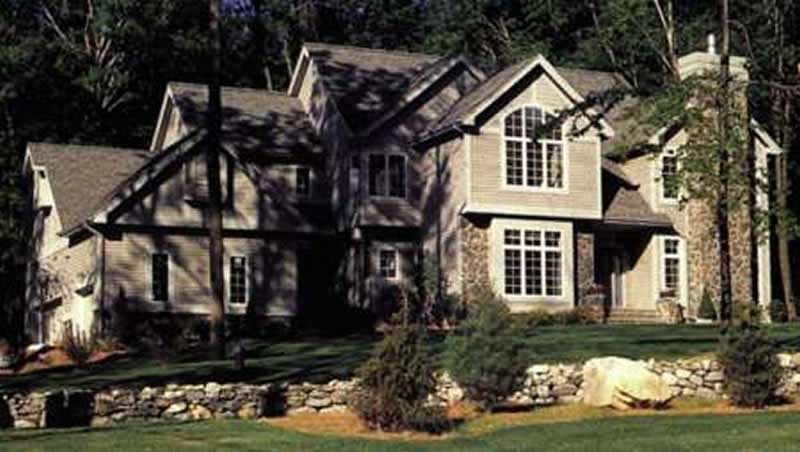 Front view of European home (ThePlanCollection: House Plan #146-1683)