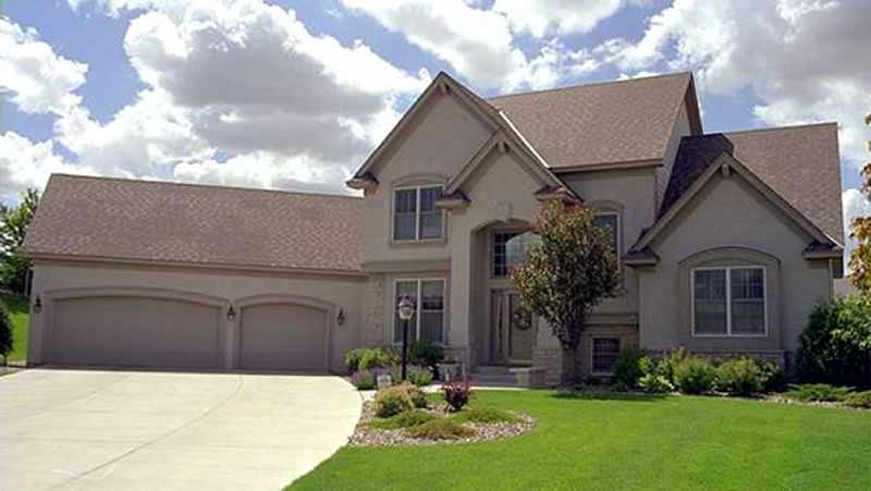 Front view of European home (ThePlanCollection: House Plan #146-1885)