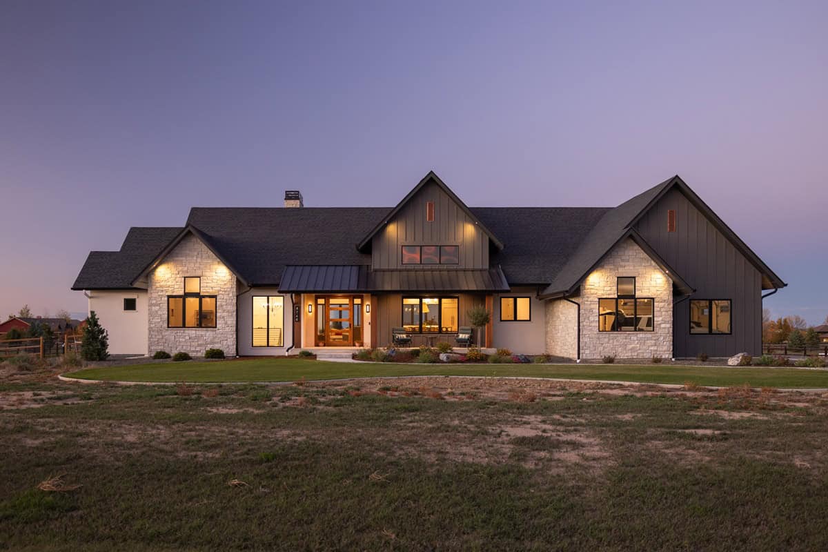 A Modern Farmhouse elevation with board-and-batten gables, stone wainscot, and a covered entry porch. 2 beds, 3,214 sq ft — Plan #161-1303.