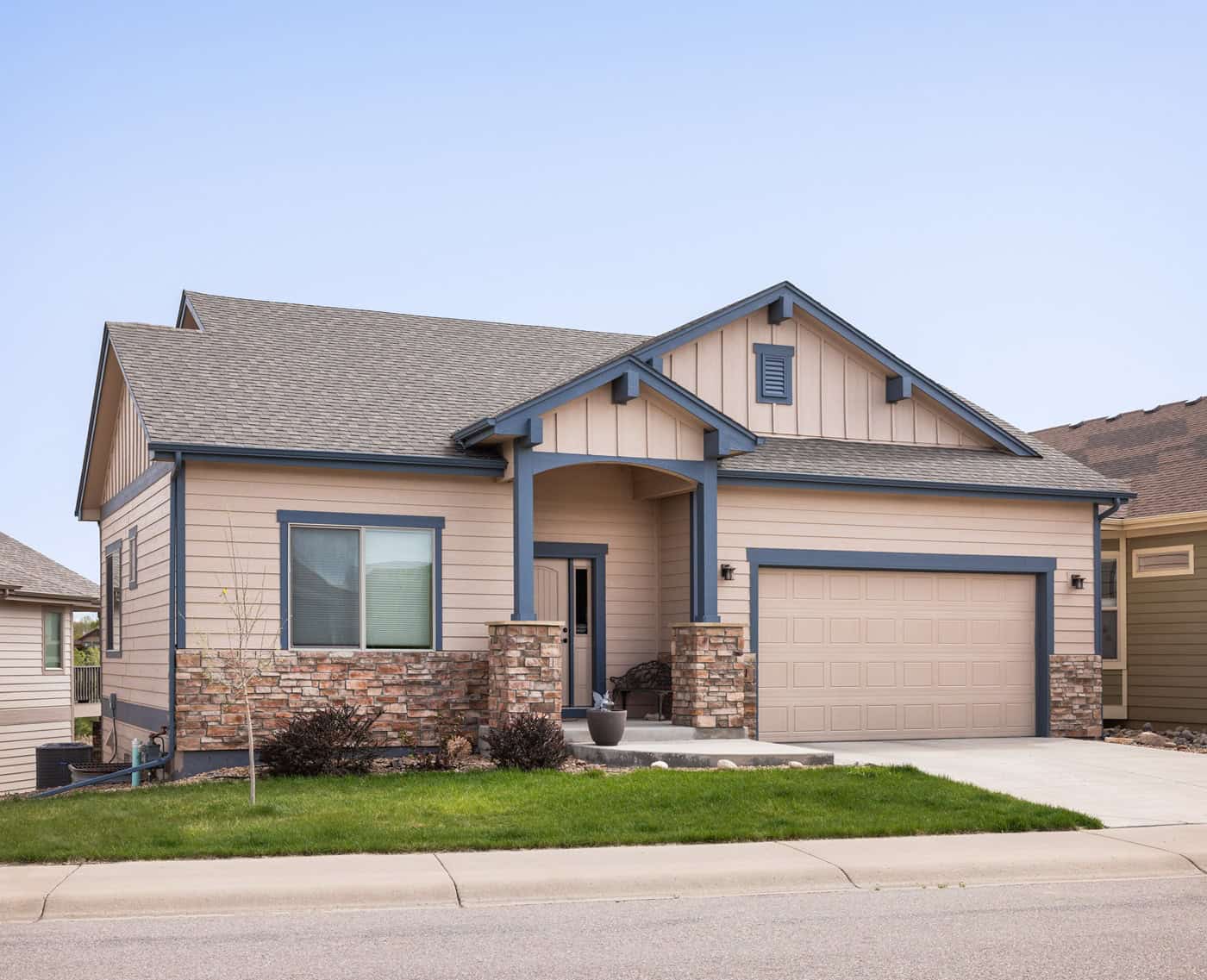 Craftsman-style ranch home with mixed stone and siding, covered front porch, and gable roofline. 3 beds, 1,748 sq ft - Plan #161-1324.