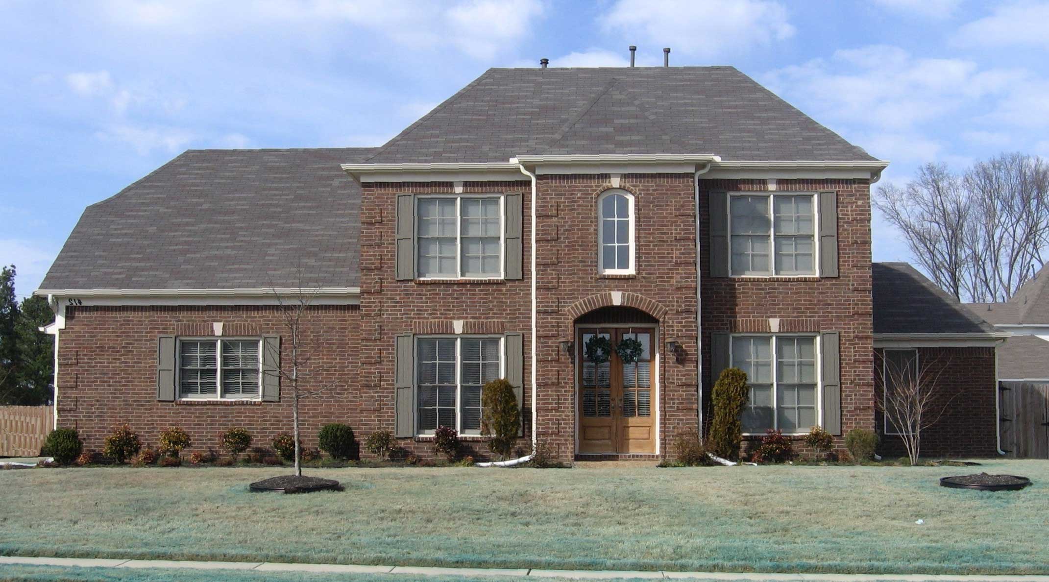 Front view of French home (ThePlanCollection: House Plan #170-1377)