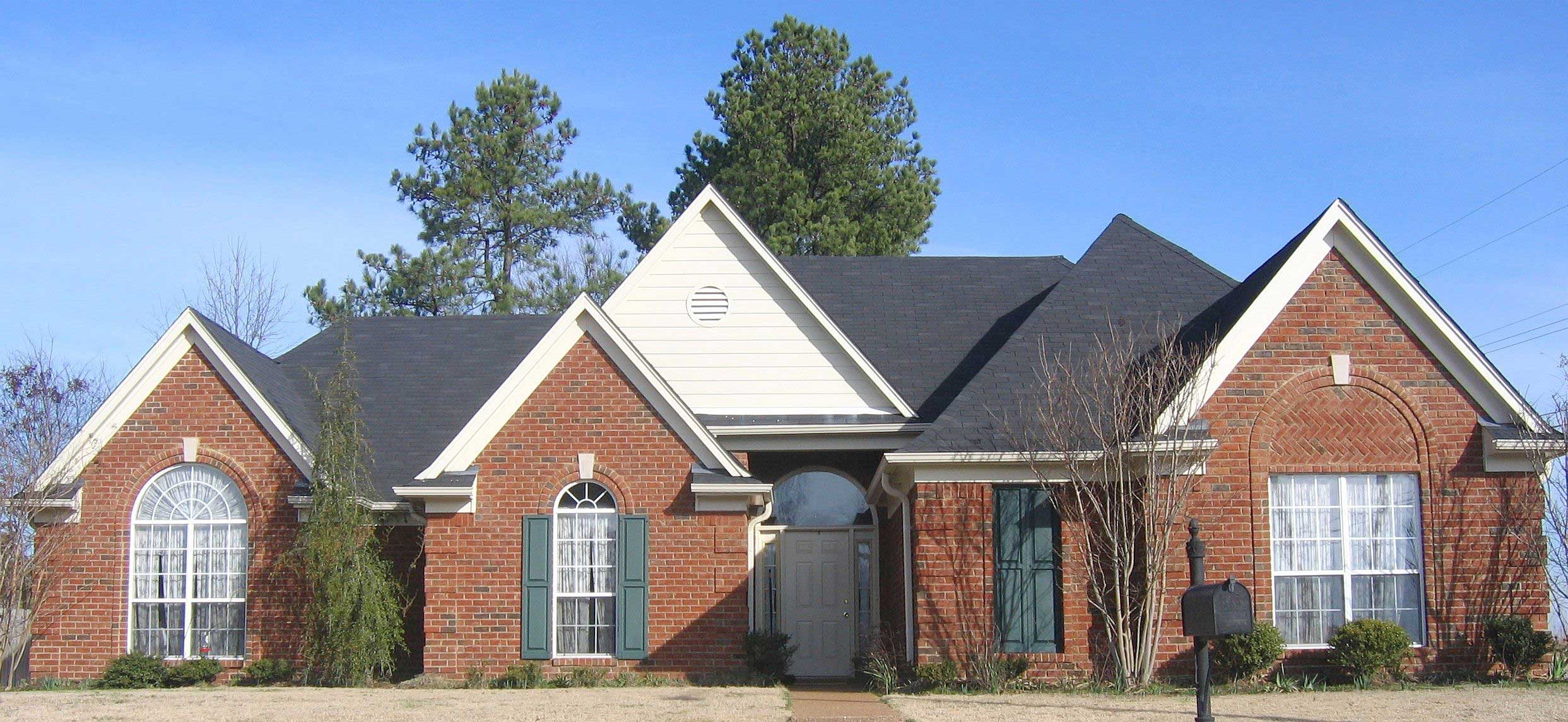 Front view of French home (ThePlanCollection: House Plan #170-1452)