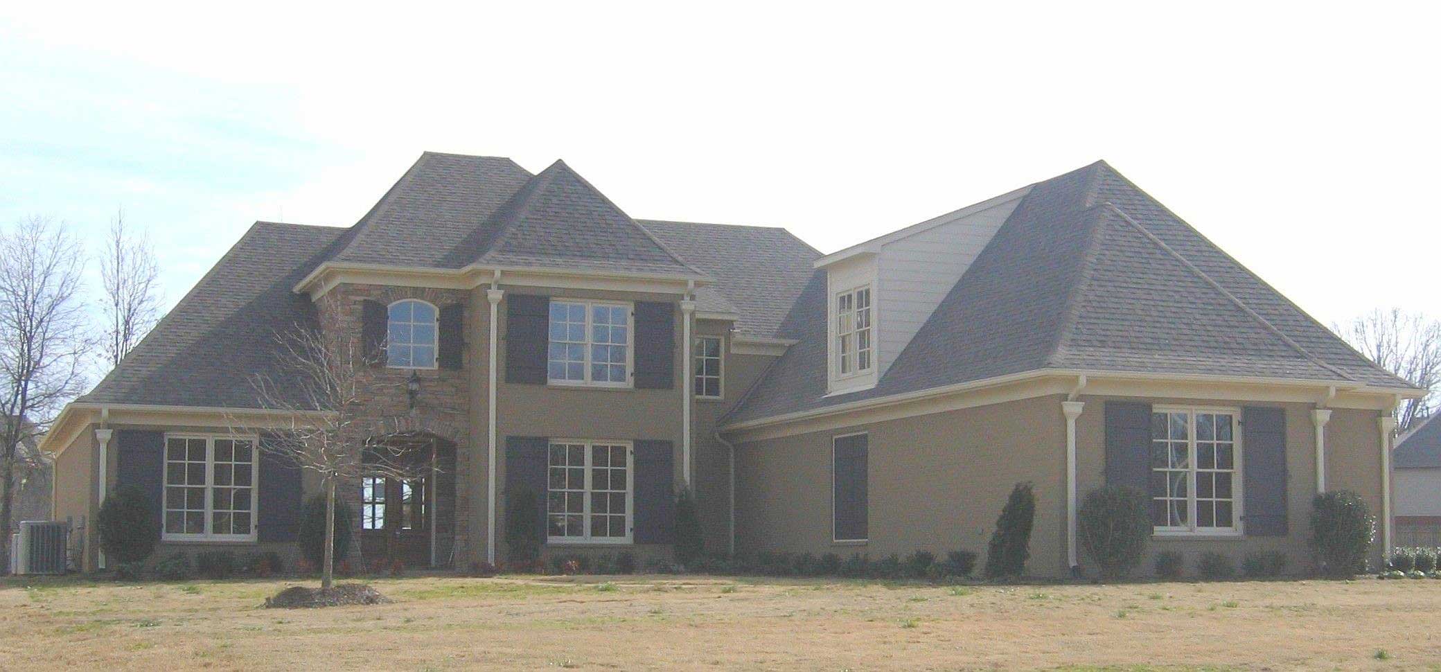 Front view of French home (ThePlanCollection: House Plan #170-1483)