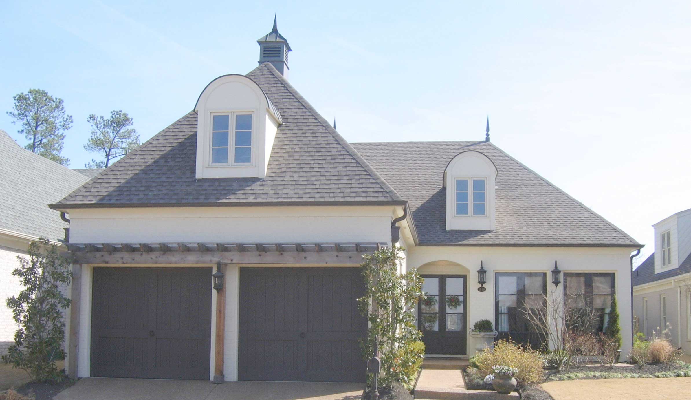 Front view of French home (ThePlanCollection: House Plan #170-1484)