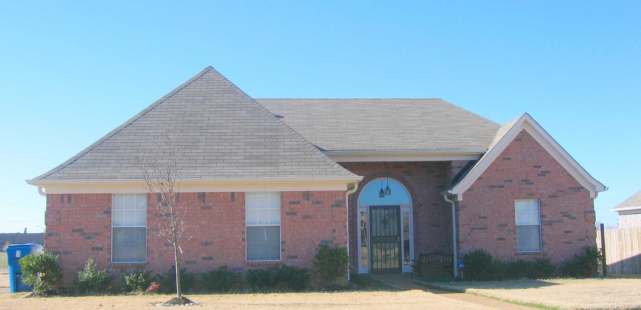Front view of French home (ThePlanCollection: House Plan #170-1541)