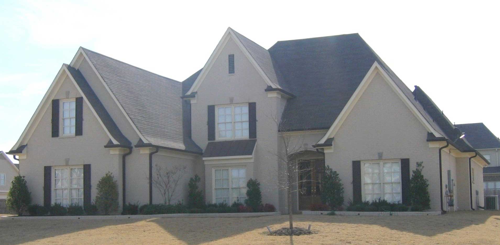 Front view of French home (ThePlanCollection: House Plan #170-1664)