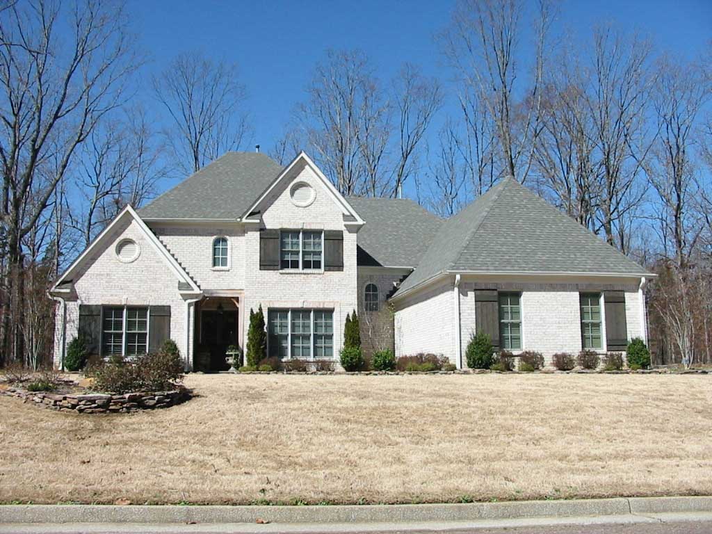 Front view of French home (ThePlanCollection: House Plan #170-1767)