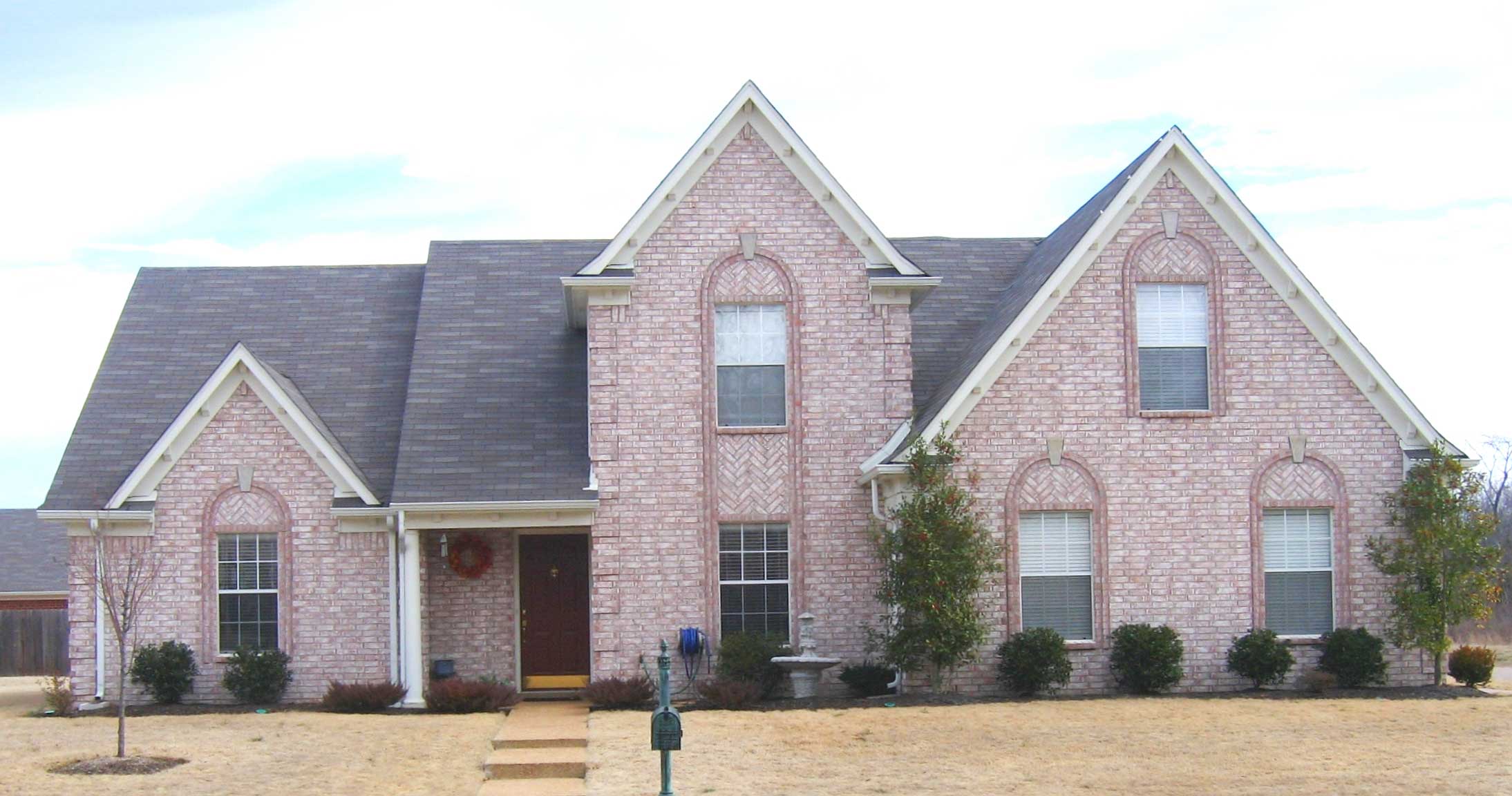 Front view of French home (ThePlanCollection: House Plan #170-1846)