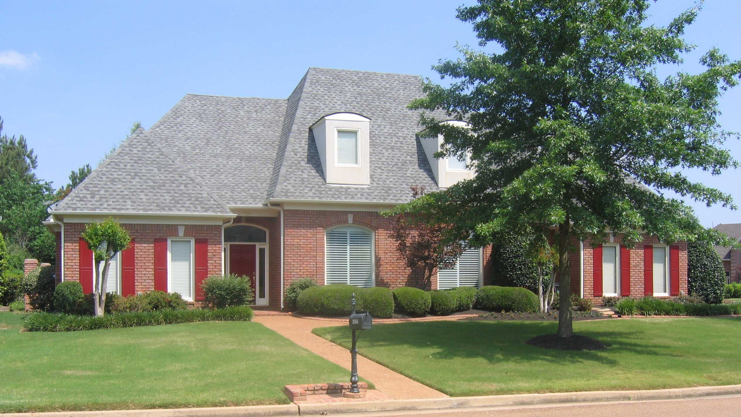 Front view of Colonial home (ThePlanCollection: House Plan #170-1851)
