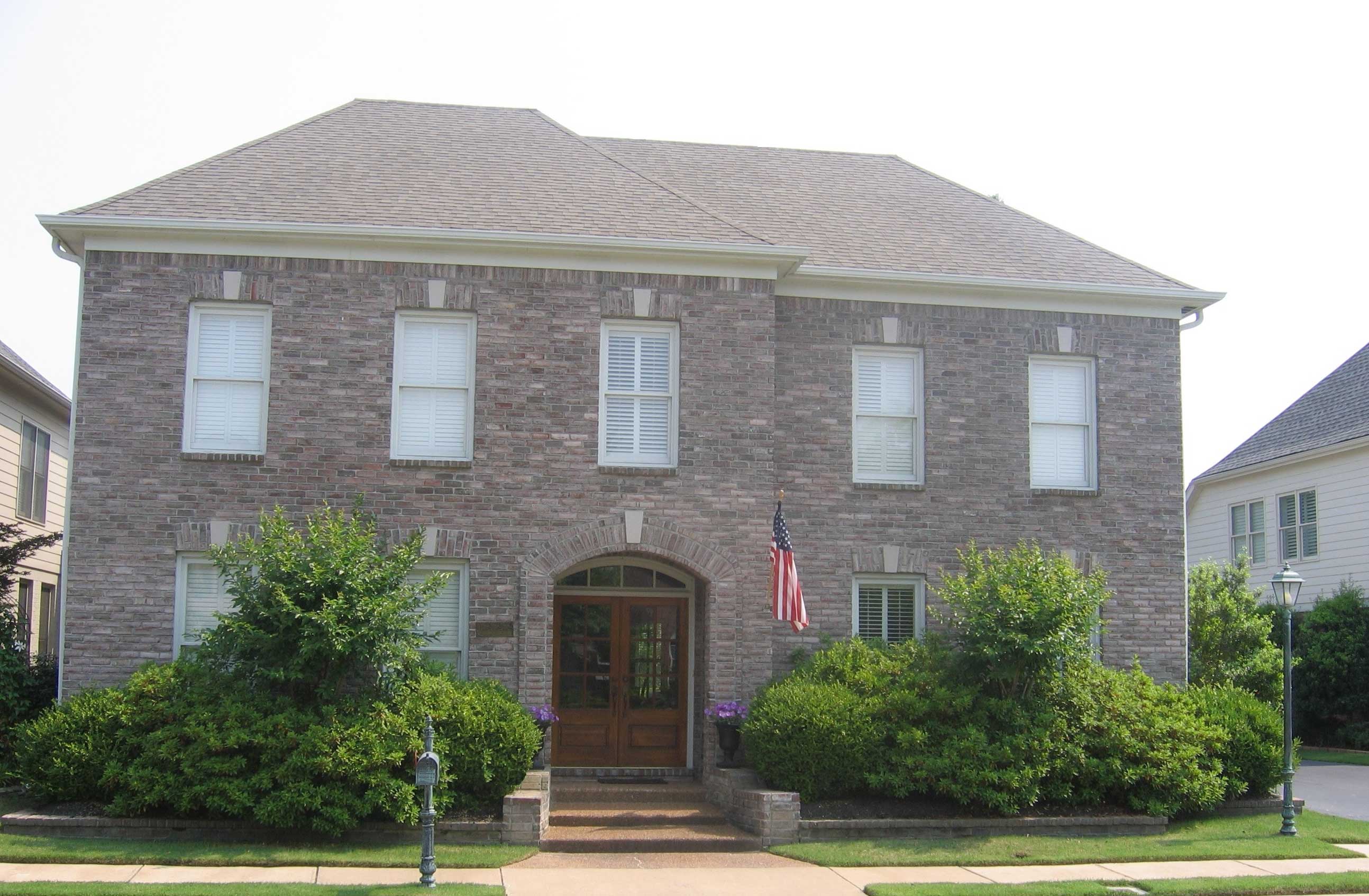 Front view of French home (ThePlanCollection: House Plan #170-1871)