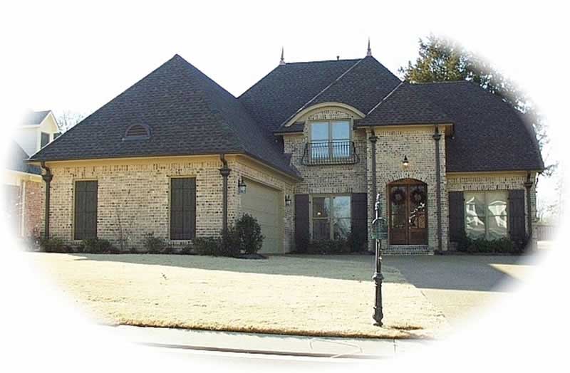 Front view of French home (ThePlanCollection: House Plan #170-2062)