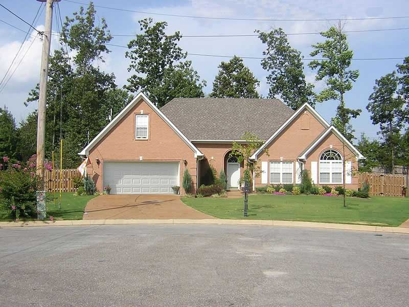 Front view of French home (ThePlanCollection: House Plan #170-2371)