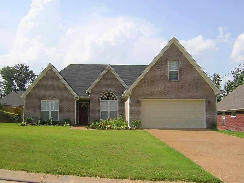Front view of French home (ThePlanCollection: House Plan #170-2377)