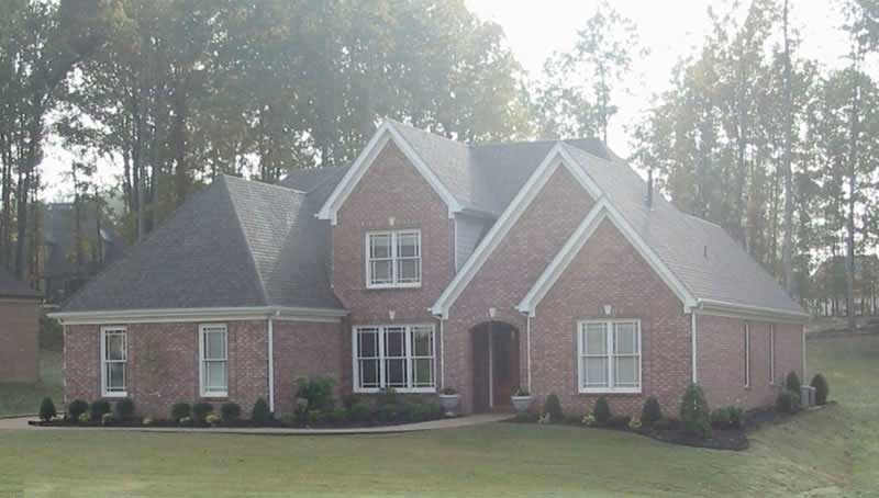 Front view of French home (ThePlanCollection: House Plan #170-3142)