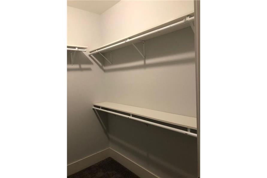 Large master closet with shelves