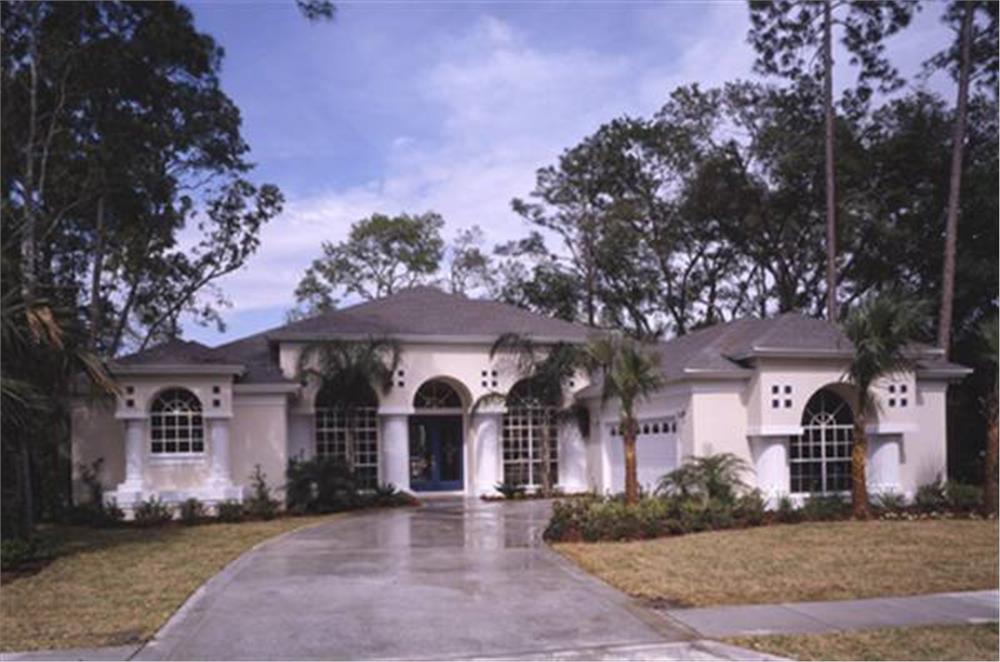 Front elevation photo of this Mediterranean home (ThePlanCollection: House Plan #190-1000)