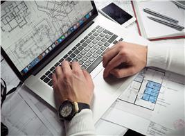 Architect on PC Laptop Working on Blueprints - CAD File