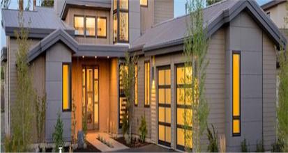 House design in the Modern style with stained wood lap siding and stone exterior.