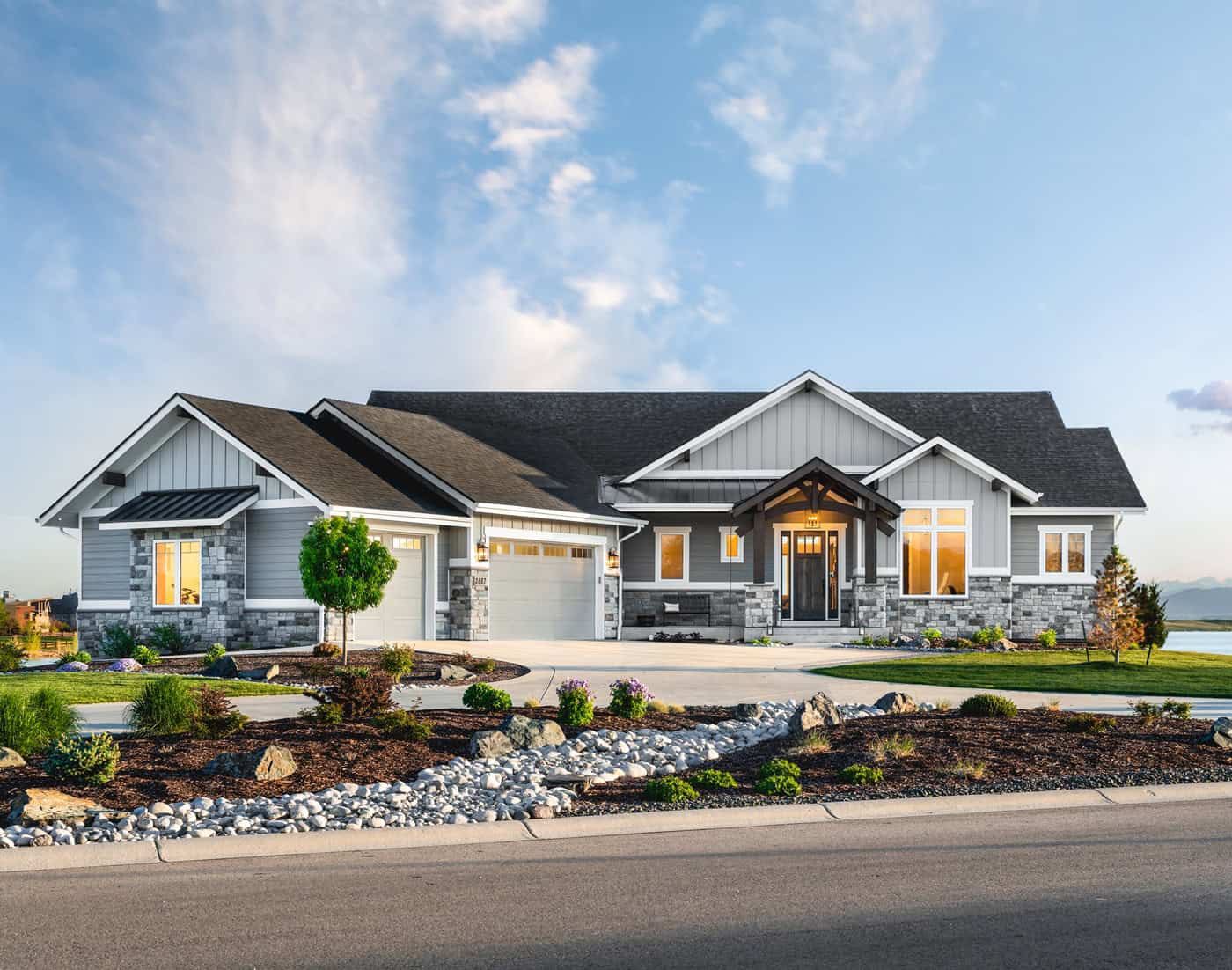 Craftsman Ranch home with stone entry gable, board and batten siding, and covered front porch, Plan 161-1291
