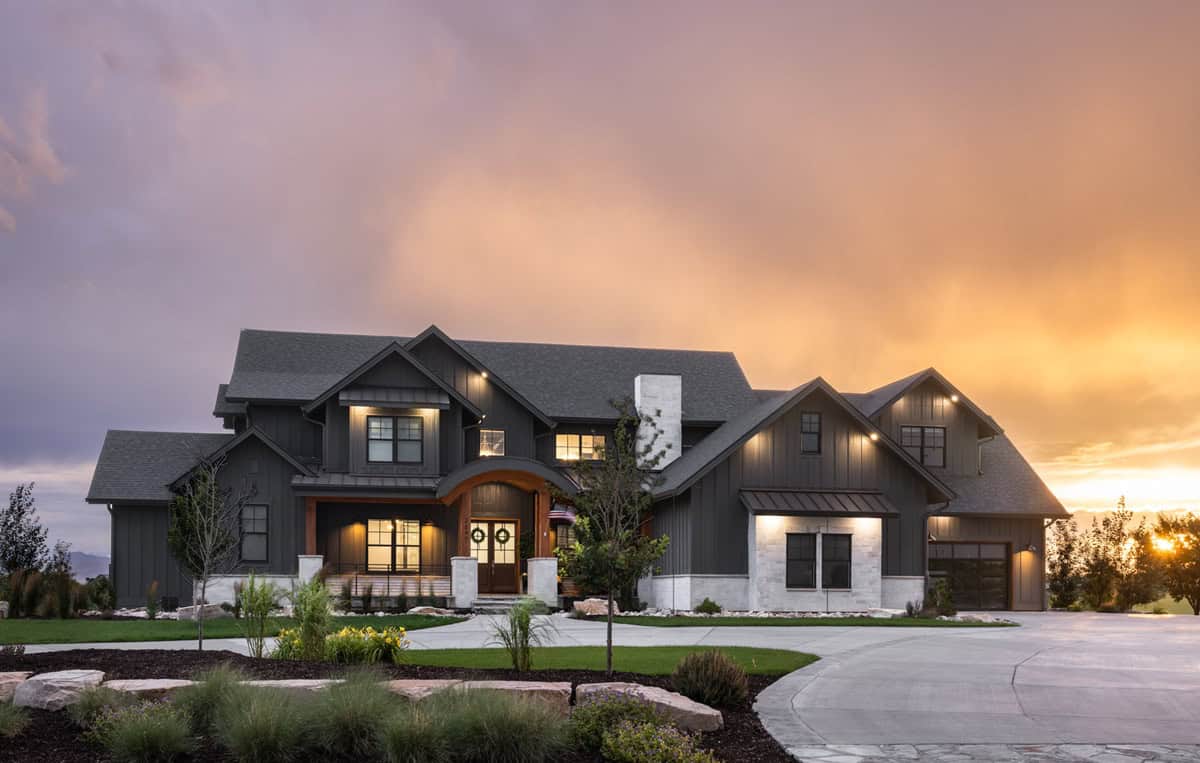 Modern Farmhouse home with board and batten siding, stone accents, gable roofline, and covered front porch, Plan 161-1292