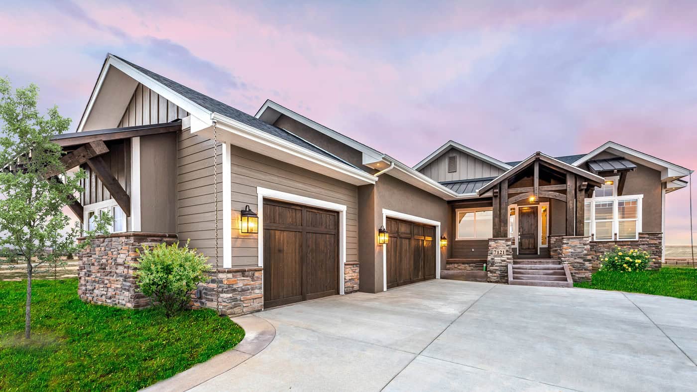 Craftsman ranch exterior with stone and board-and-batten siding, gable rooflines, and courtyard entry garage, Plan 161-1301