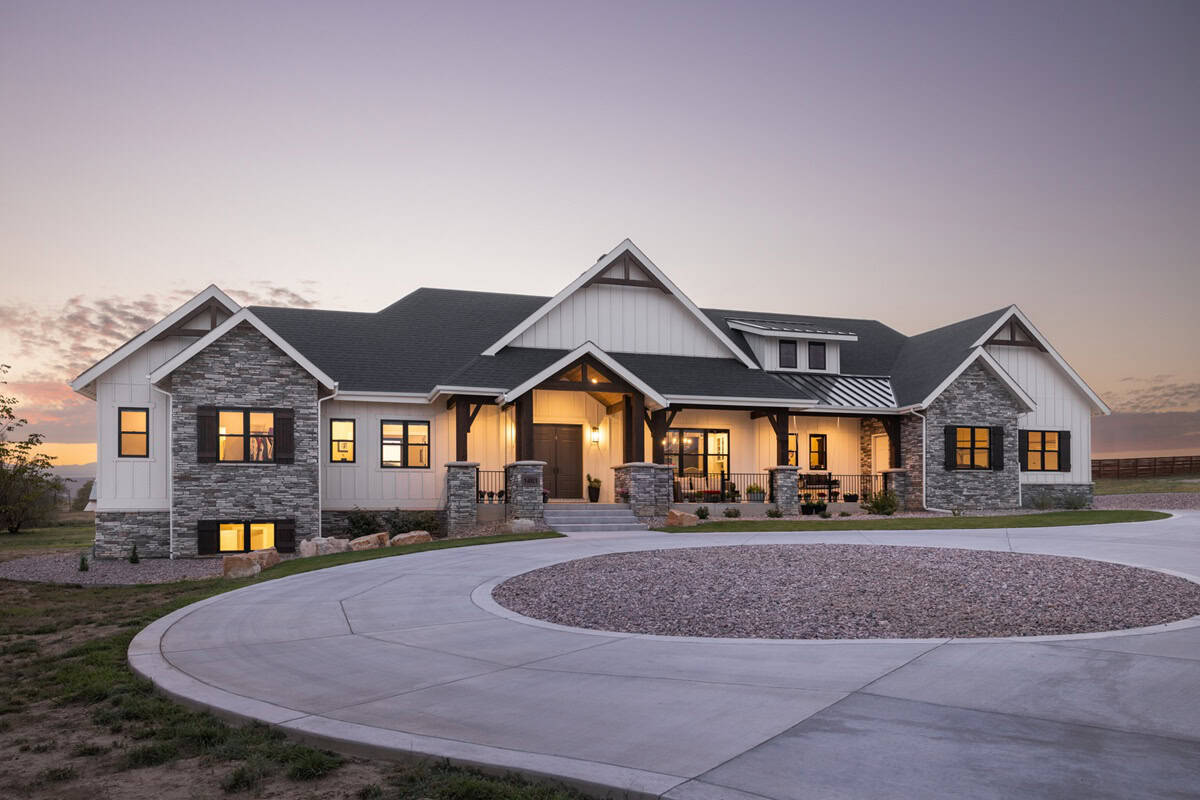 Modern Farmhouse ranch exterior with board and batten siding, stone accents, gabled metal roof, House Plan 161-1305