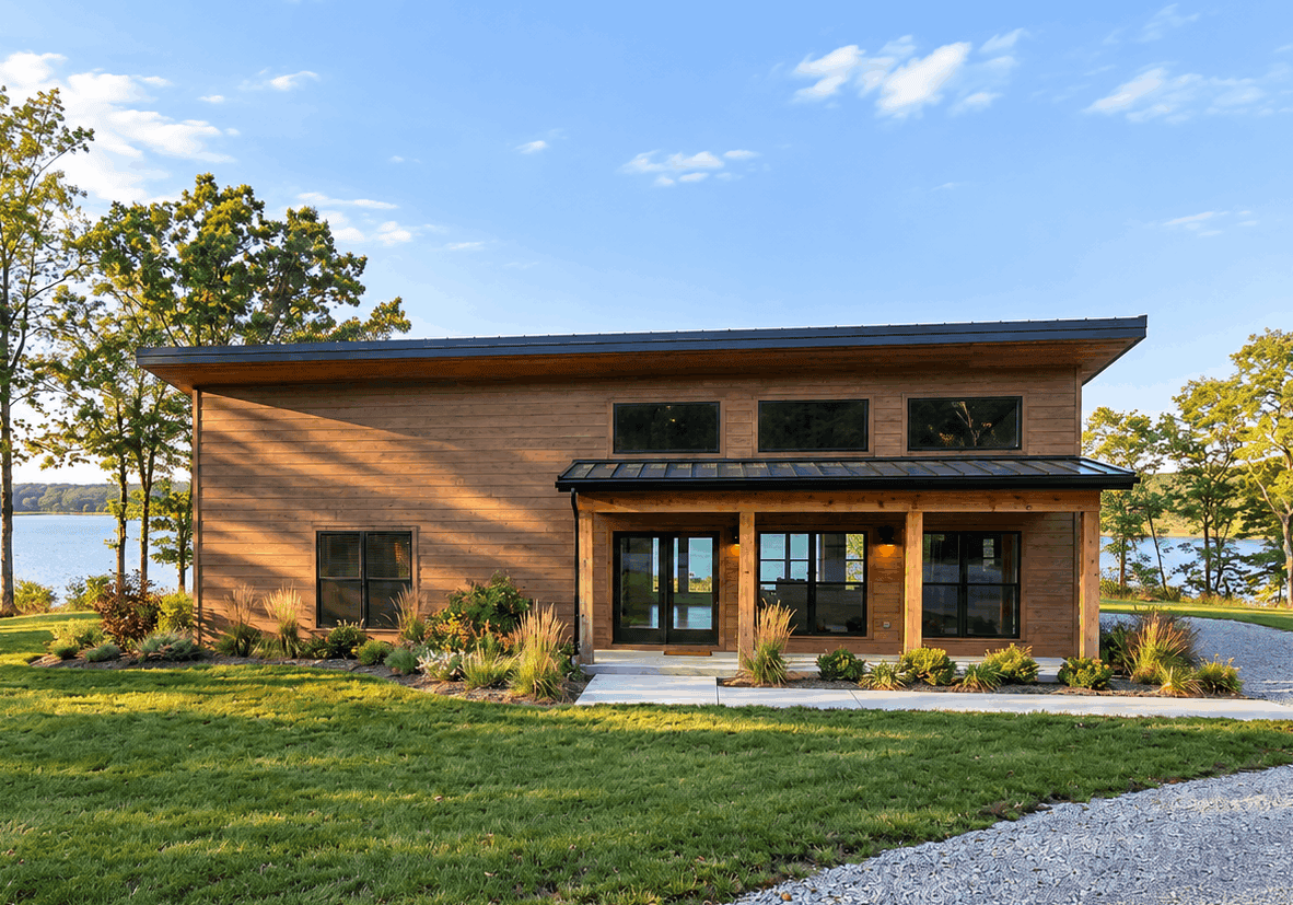 Modern shed-roof home with metal standing-seam roofing, covered front porch, and vinyl siding — 5 bedrooms, 2,250 sq ft — Plan #221-1017.
