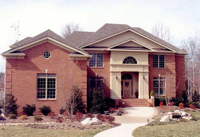 Front elevation of Colonial home (ThePlanCollection: House Plan #106-1166)