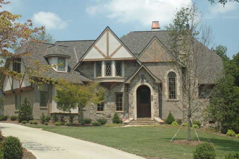 Front elevation of Tudor home (ThePlanCollection: House Plan #127-1034)