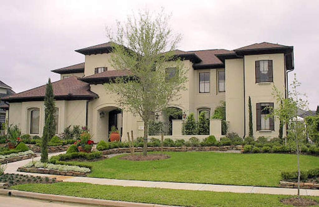 Front elevation of Luxury home (ThePlanCollection: House Plan #134-1181)