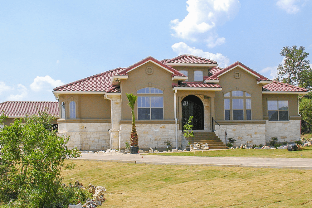 Front elevation of Mediterranean home (ThePlanCollection: House Plan #136-1012)