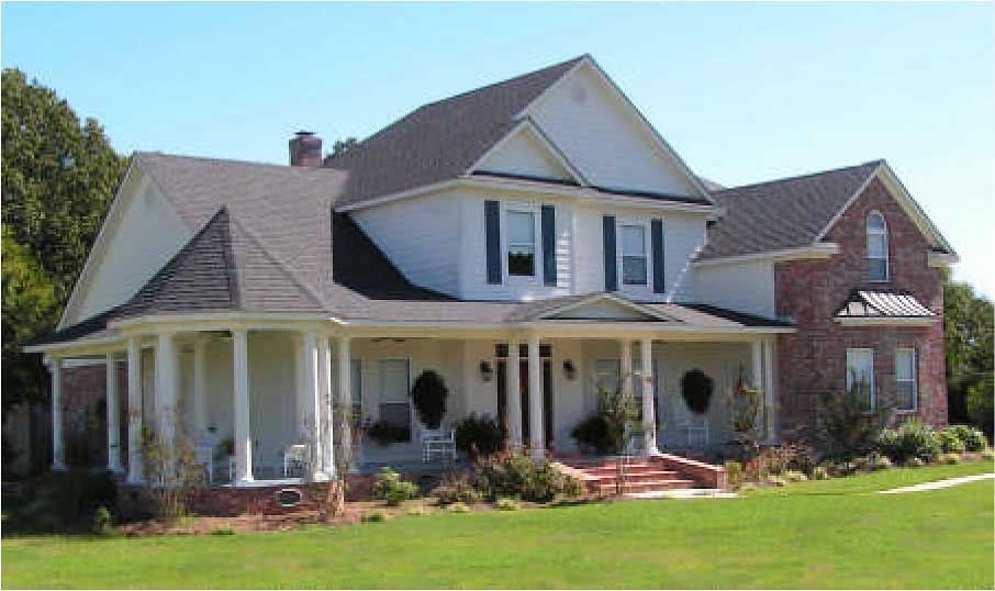 This is a color photo of these Country Homeplans.