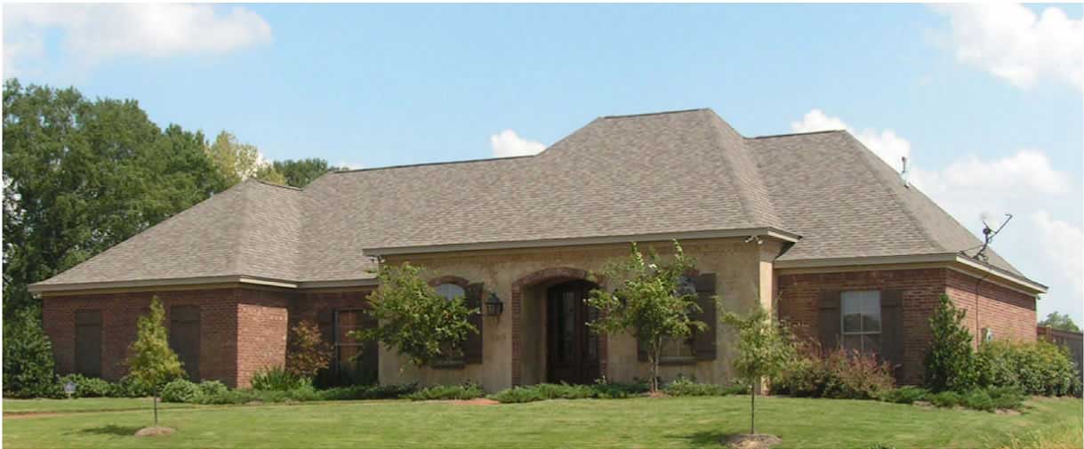 This is a color photo of these French Country House Plans.